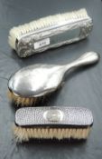 A white metal mounted Oriental design combination brush and mirror, of oblong form decorated with