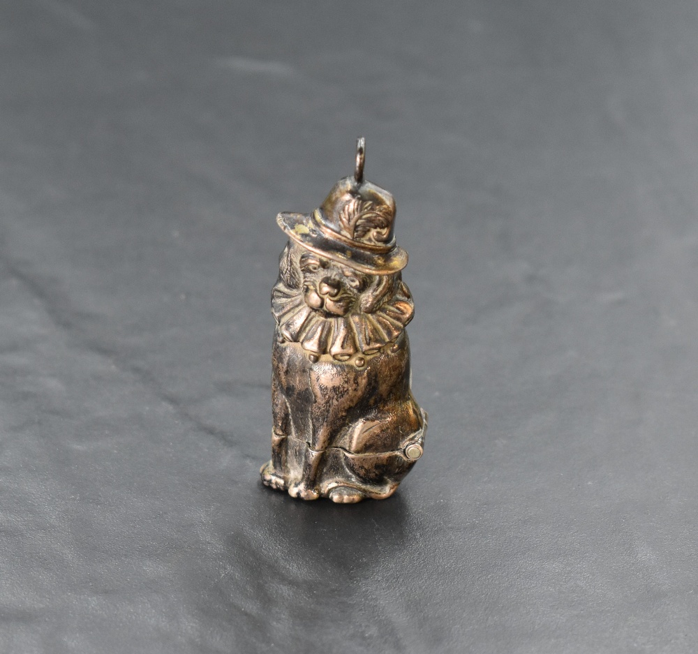 A novelty cast white metal vesta case, formed as an anthropomorphic dog, unmarked, 6.5cm.