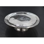 An Edwardian Britannia silver pedestal visiting card tray, of moulded circular form, raised on a