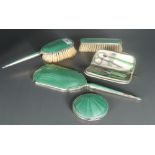 A George VI guilloche enamelled silver backed three-piece dressing table set, comprising hand