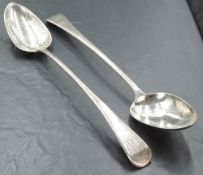 A pair of George III silver Old English pattern serving spoons, each with engraved initials to