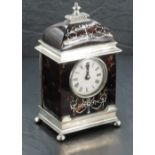 An Edwardian silver and tortoiseshell mantel clock, the domed top with turned and gadrooned finial