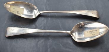 A pair of Georgian silver table spoons of Old English form bearing monogram to terminals, London