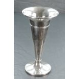 A silver vase of plain trumpet form having a weighted circular base, Birmingham 1922, makers mark