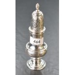 A George III silver sugar caster, of traditional form with spirally fluted finial over the domed and