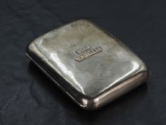 A Victorian silver cigarette case, of rounded and hinged rectangular form, the facia applied with