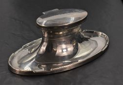 A George V silver Capstan inkwell, of oval form, the flared base rim with integral pen stands, marks