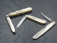 A group of two Mother-Of-Pearl mounted and silver bladed fruit knives, sold together with a silver