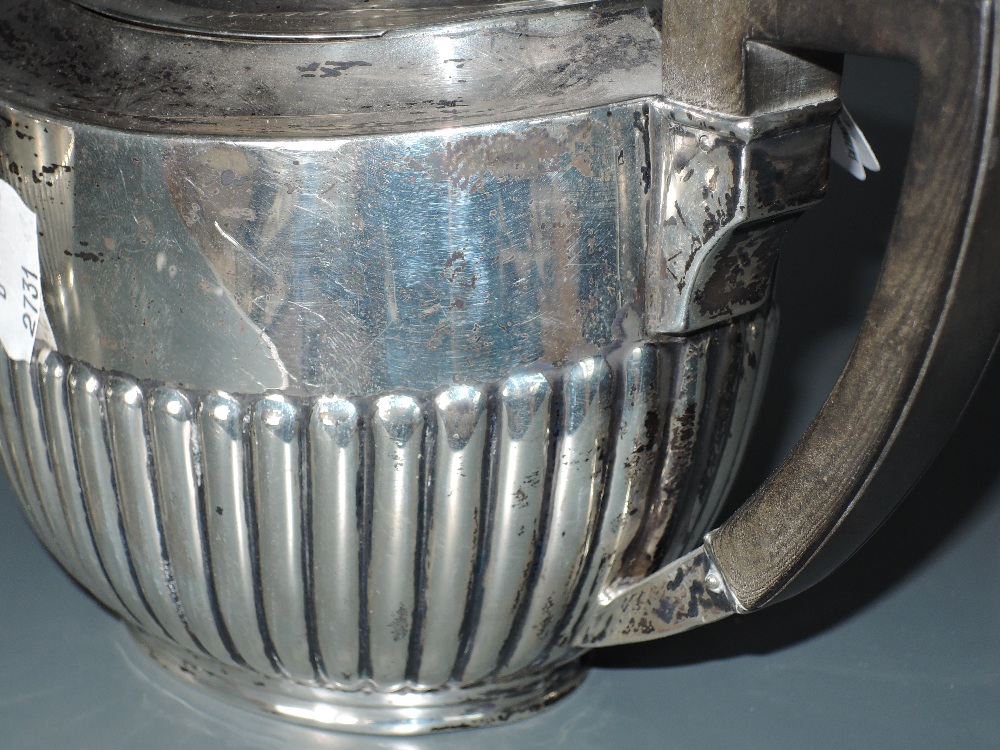 An Edwardian silver three piece teaset, of half fluted oval form with angular handles, marks for - Image 3 of 4