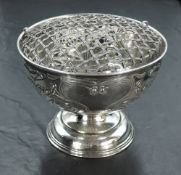 An Edwardian Art Nouveau silver rose bowl, with removable domed grille over the tapering cylindrical