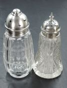 Two glass sugar casters having cut glass decoration and HM silver lids