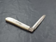 An Edwardian Mother-of-Pearl mounted and silver bladed pocket knife, with engraved decoration to