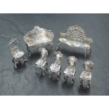 A group of seven miniature imported Hanau white metal salon furniture items, comprising two