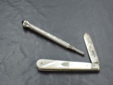 A George V Mother-of-Pearl mounted and silver bladed pocket knife, with engraved decoration to