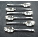 Six Georgian silver teaspoons of fiddle back form having cut edges and crest to terminals, bottom