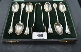 A George V cased set of six silver teaspoons and sugar tongs, having oval bowls and tapering handles