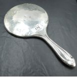 A George V silver hand mirror, of traditional form with muted stylised detail, marks for