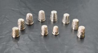 Nine HM silver thimbles of various dates and forms including Charles Horner and a DORCAS white metal