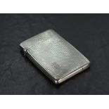 A 1930's silver visiting card case, of hinged rectangular form, engine-turned throughout with