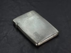 A 1930's silver visiting card case, of hinged rectangular form, engine-turned throughout with
