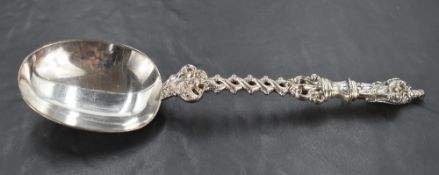 An Edwardian silver apostle spoon, of oversized proportions, with figural surmount over a twisted