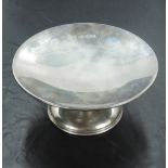 A George VI silver pedestal visiting card tray, of shallow dished circular form, raised on a