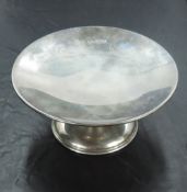 A George VI silver pedestal visiting card tray, of shallow dished circular form, raised on a