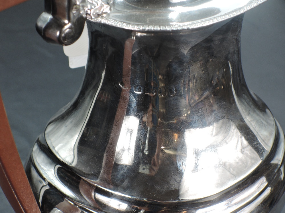 A 1930's silver hot water pot, of rounded rectangular baluster form, the hinged finial topped - Image 2 of 2