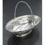 A Georgian silver sweetmeat basket of boat form having pierced and bright cut decoration, beaded