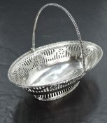 A Georgian silver sweetmeat basket of boat form having pierced and bright cut decoration, beaded