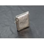 A George V silver vesta case, of traditional form with scrolled engraving, marks for Birmingham