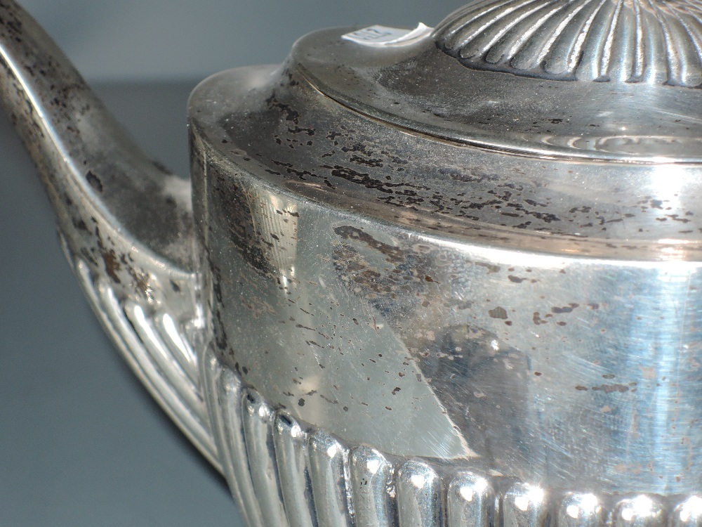 An Edwardian silver three piece teaset, of half fluted oval form with angular handles, marks for - Image 4 of 4