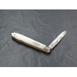 A late Victorian Mother-of-Pearl mounted and silver bladed pocket knife, the mounts with engraved