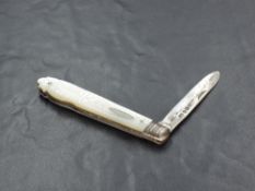 A late Victorian Mother-of-Pearl mounted and silver bladed pocket knife, the mounts with engraved