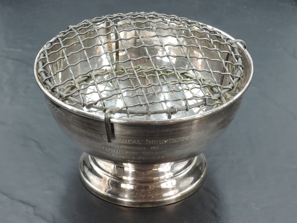 An Elizabeth II silver rose bowl, of circular form with rolled rim and engraved presentation