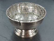An Elizabeth II silver rose bowl, of circular form with rolled rim and engraved presentation