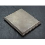 A 1930's silver cigarette case, of hinged rectangular form with engine-turned surface and