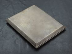 A 1930's silver cigarette case, of hinged rectangular form with engine-turned surface and