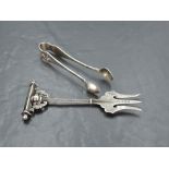 A late Victorian silver trident cold meat fork, with engraved detail and T-form terminal with