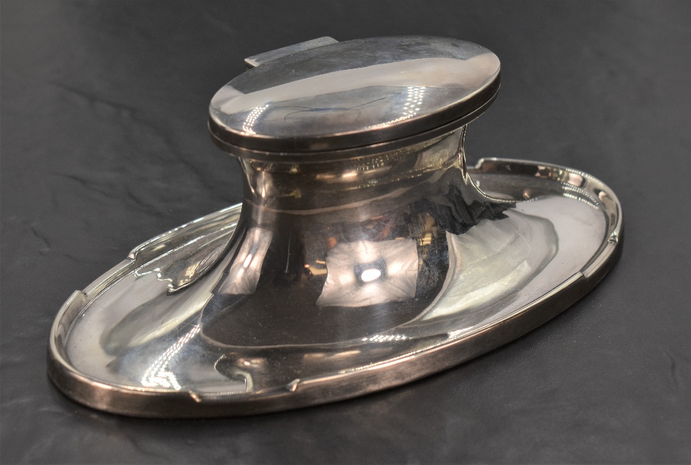 A George V silver Capstan inkwell, of oval form, the flared base rim with integral pen stands, marks - Image 2 of 3