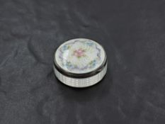 A George V silver and guilloche enamel circular box, the engine-turned surface enamelled and painted