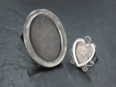 A small Victorian silver photograph frame of heart form having wire decoration and silver easel