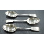 A set of three late Victorian silver fiddle pattern dessert spoons, with engraved dog crest and