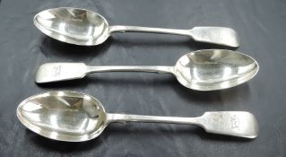 A set of three late Victorian silver fiddle pattern dessert spoons, with engraved dog crest and