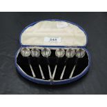 A cased set of six silver coffee spoons, marks for Sheffield 1929, all housed in a hinged demi-