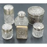 A selection of Edwardian silver mounted dressing table wares, comprising a hair brush, various