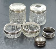 A group of silver mounted glass wares, a pair of silver rimmed cut-glass salts, a pair of silver