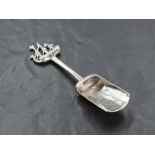 A .925 grade white metal sugar shovel, with masted ship surmount, the shovel with engraved acorn