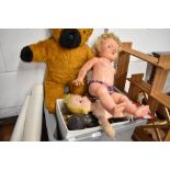 A selection of vintage and retro dolls, teddies and wooden dolls house furniture.