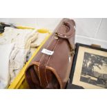 A leather bound satchel or bag